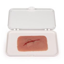 Sebtöredék üvegtöredékkel vágva 